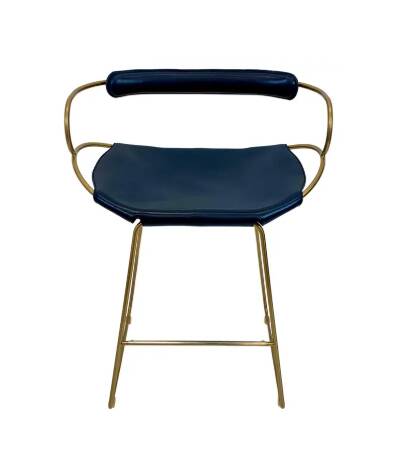 Contemporary kitchen bar stool with brass metal backrest and navy blue leather.