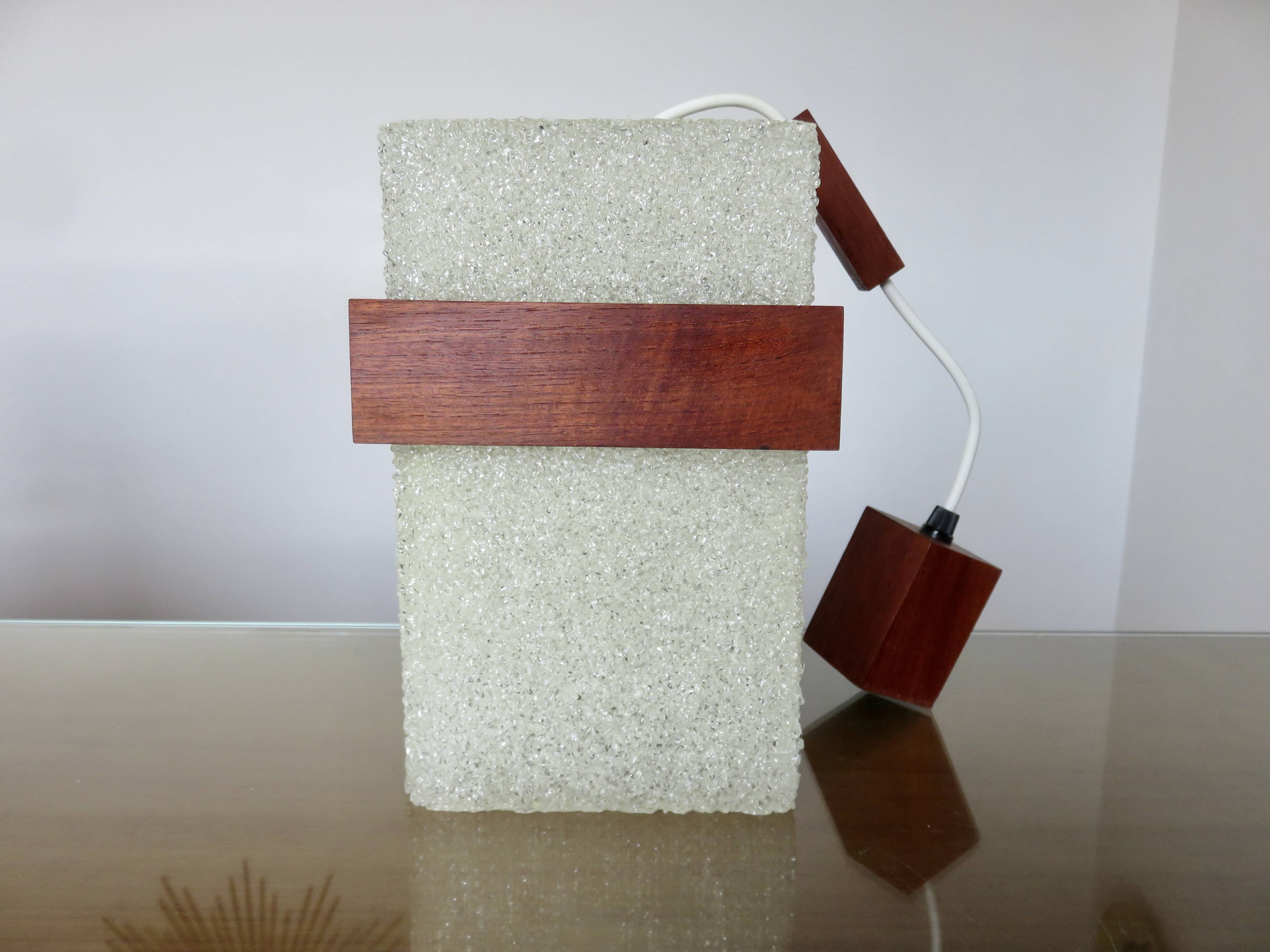 Pair of Scandinavian pendant lights in teak and perspex, 1970s.