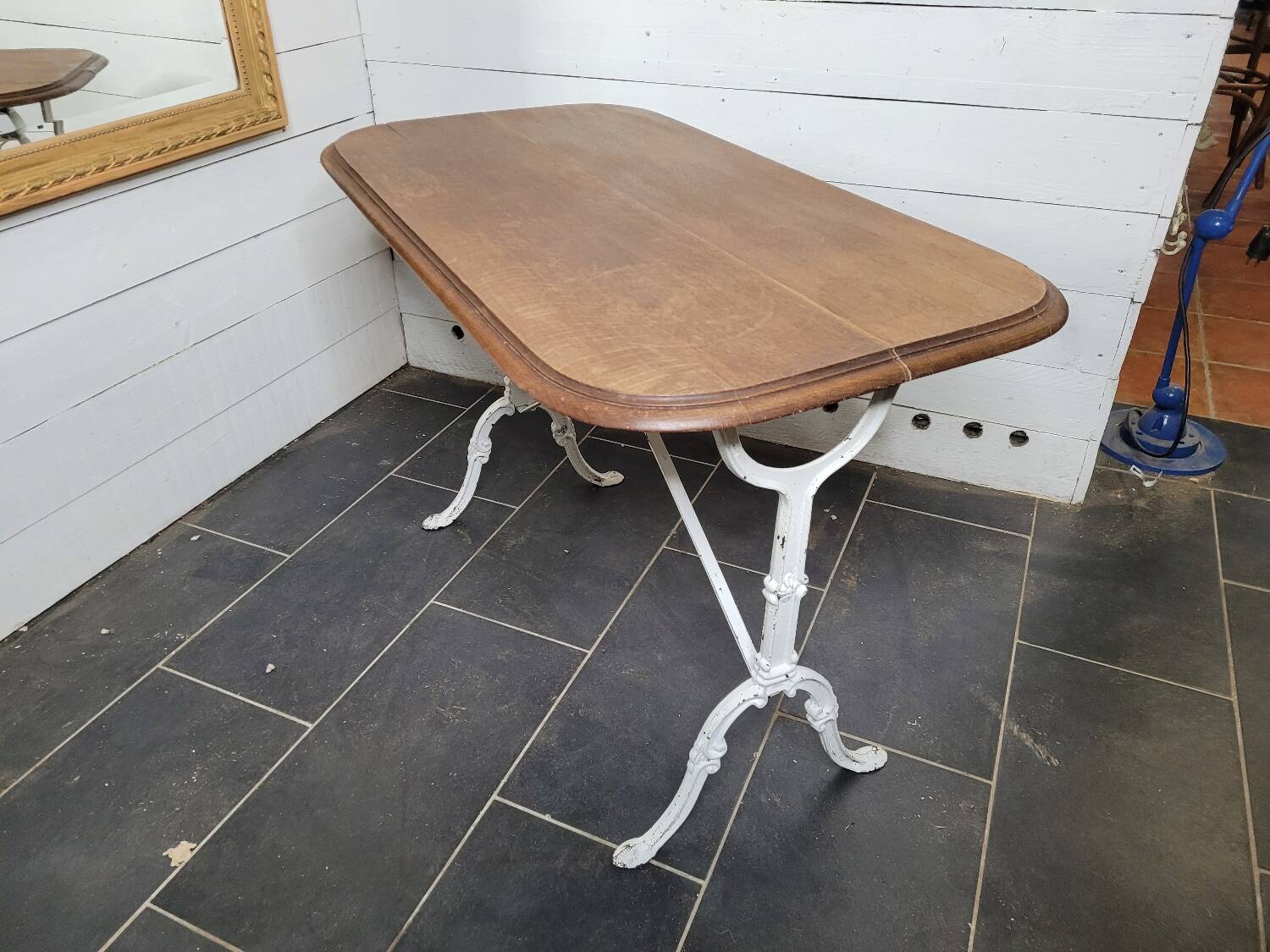 Bistro table with cast iron base and oak top