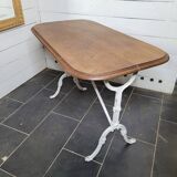 Bistro table with cast iron base and oak top