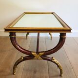 Coffee table in patinated and gilded carved wood with mirror top
