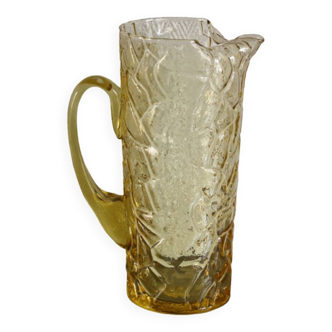 Pitcher in crumpled glass