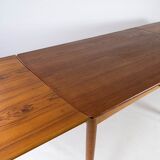 Dining table in teak with extentions and legs in oak, of danish design from the 1960s.