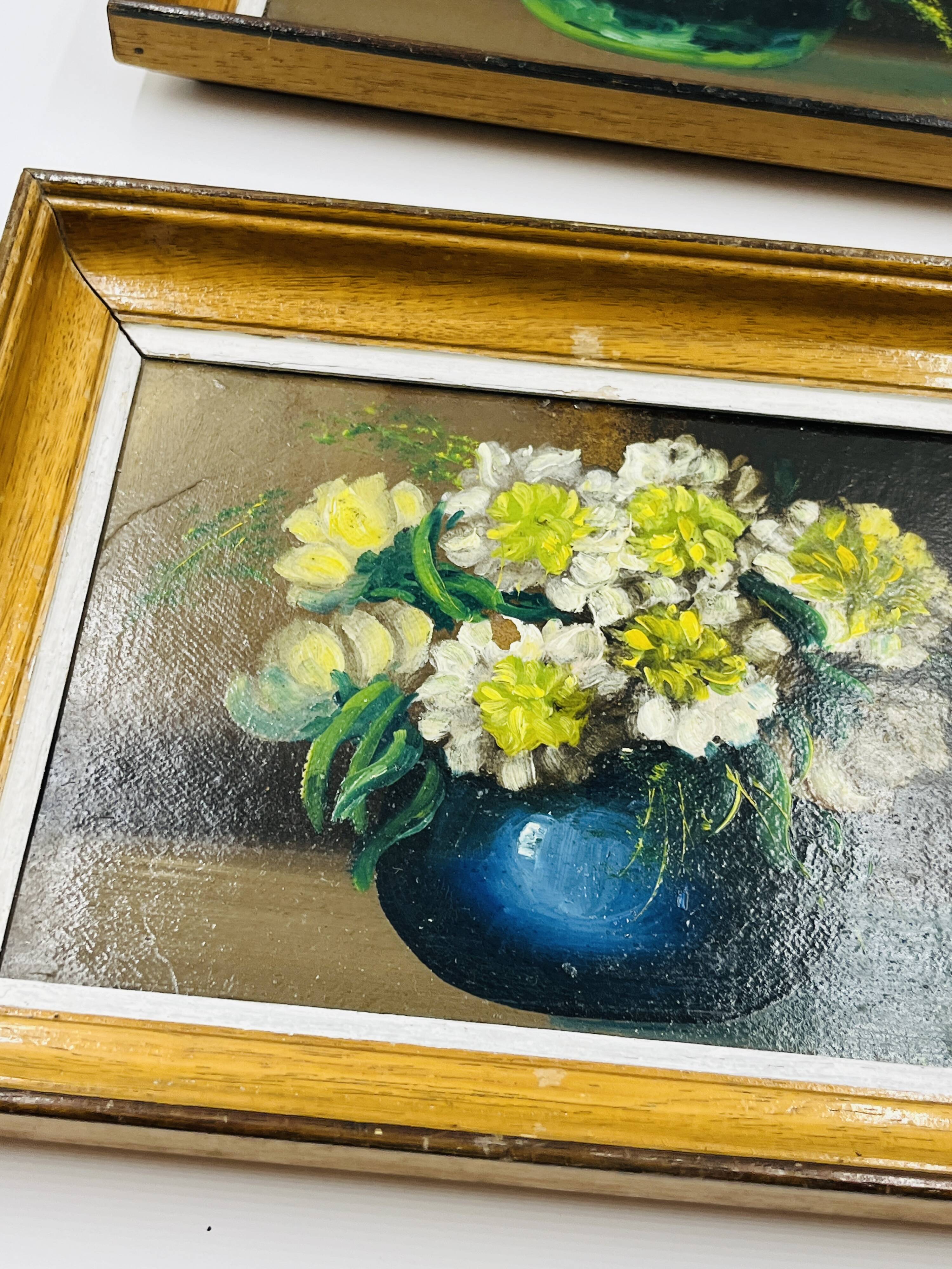 Pair of small framed vintage floral oils