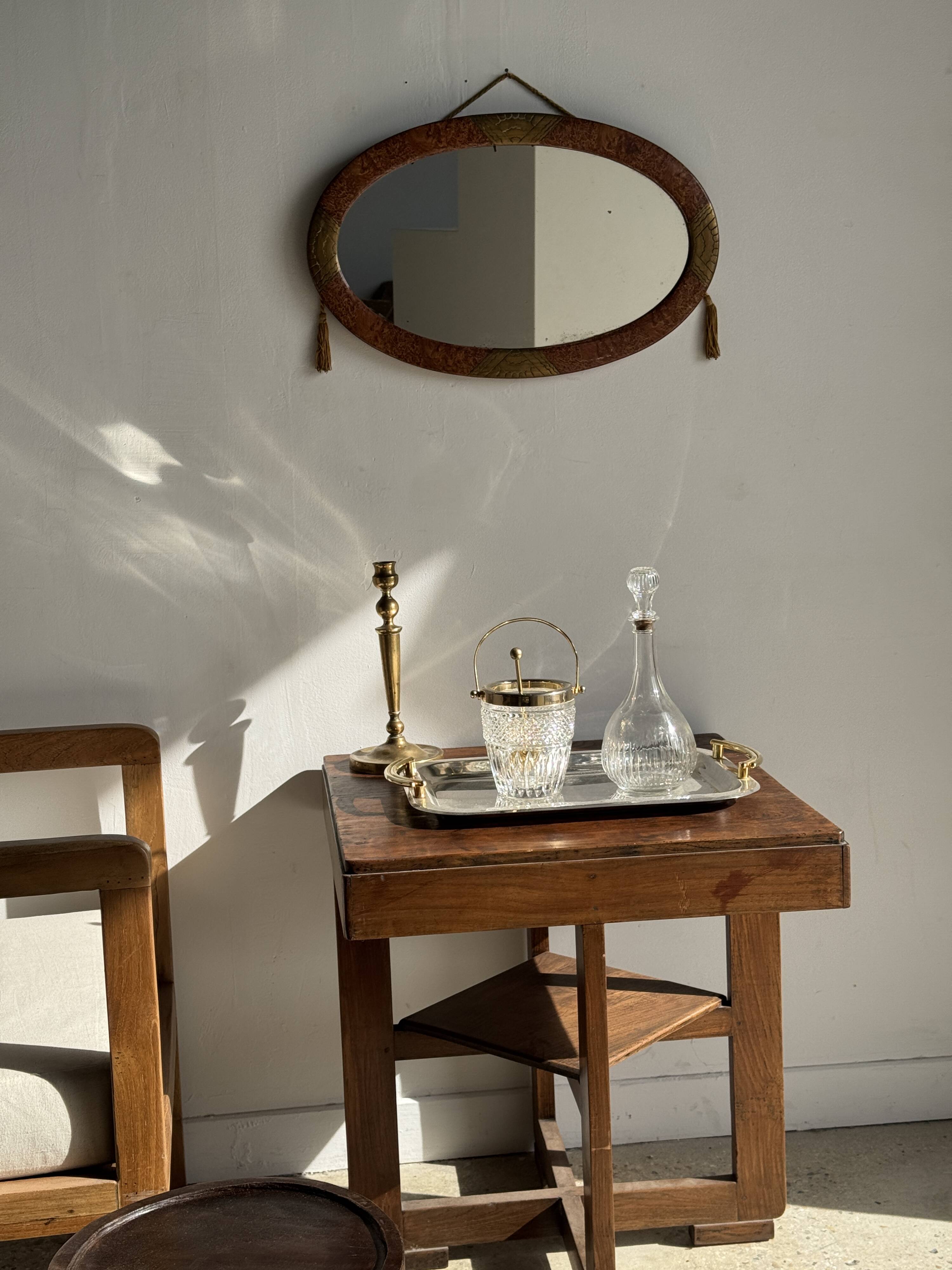 Small oval Art Deco mirror in brown and gold 33x54.
