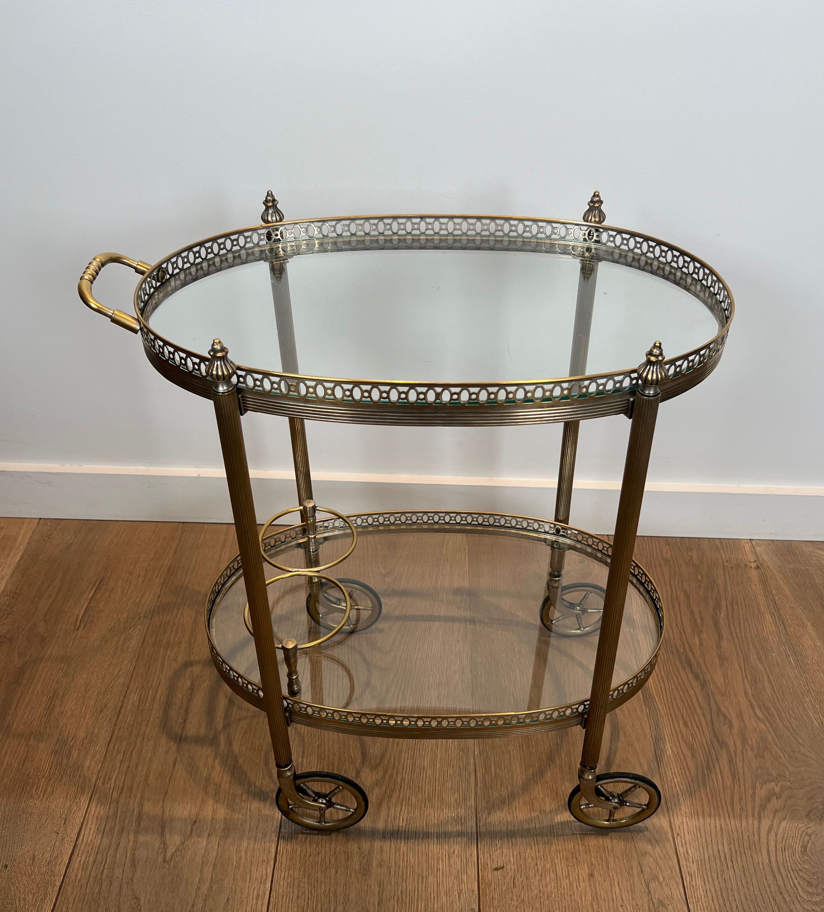 Small wheeled table in silvered brass from the Baguès house.