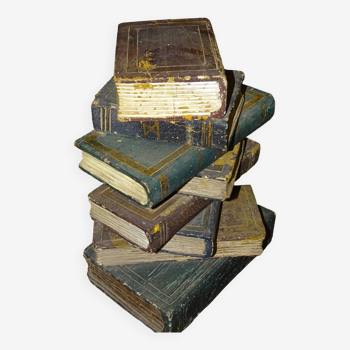 side table, end of sofa stack of wooden books, old, beautiful patina