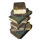 side table, end of sofa stack of wooden books, old, beautiful patina