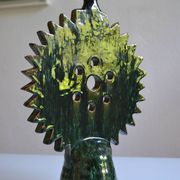 Green ceramic sun candlestick from Tamegroute, Morocco.