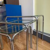 Nesting tables in chrome metal and white glass