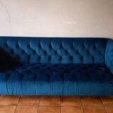 Royal blue velvet upholstered sofa
