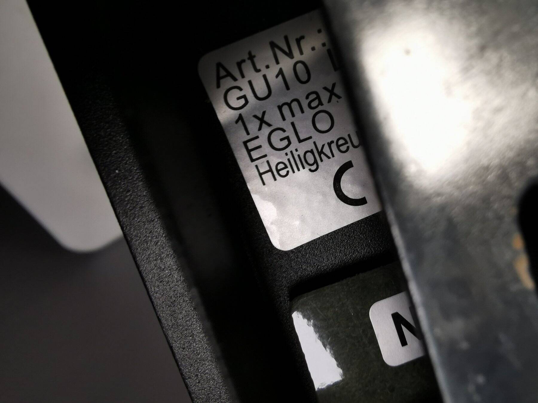 A pair of wall lamps from Eglo, in copper color and black.