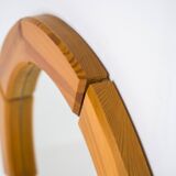 Sculptural wall-mirror in solid pine