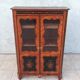 Louis XVI glass-fronted library in rosewood and amaranth veneer.