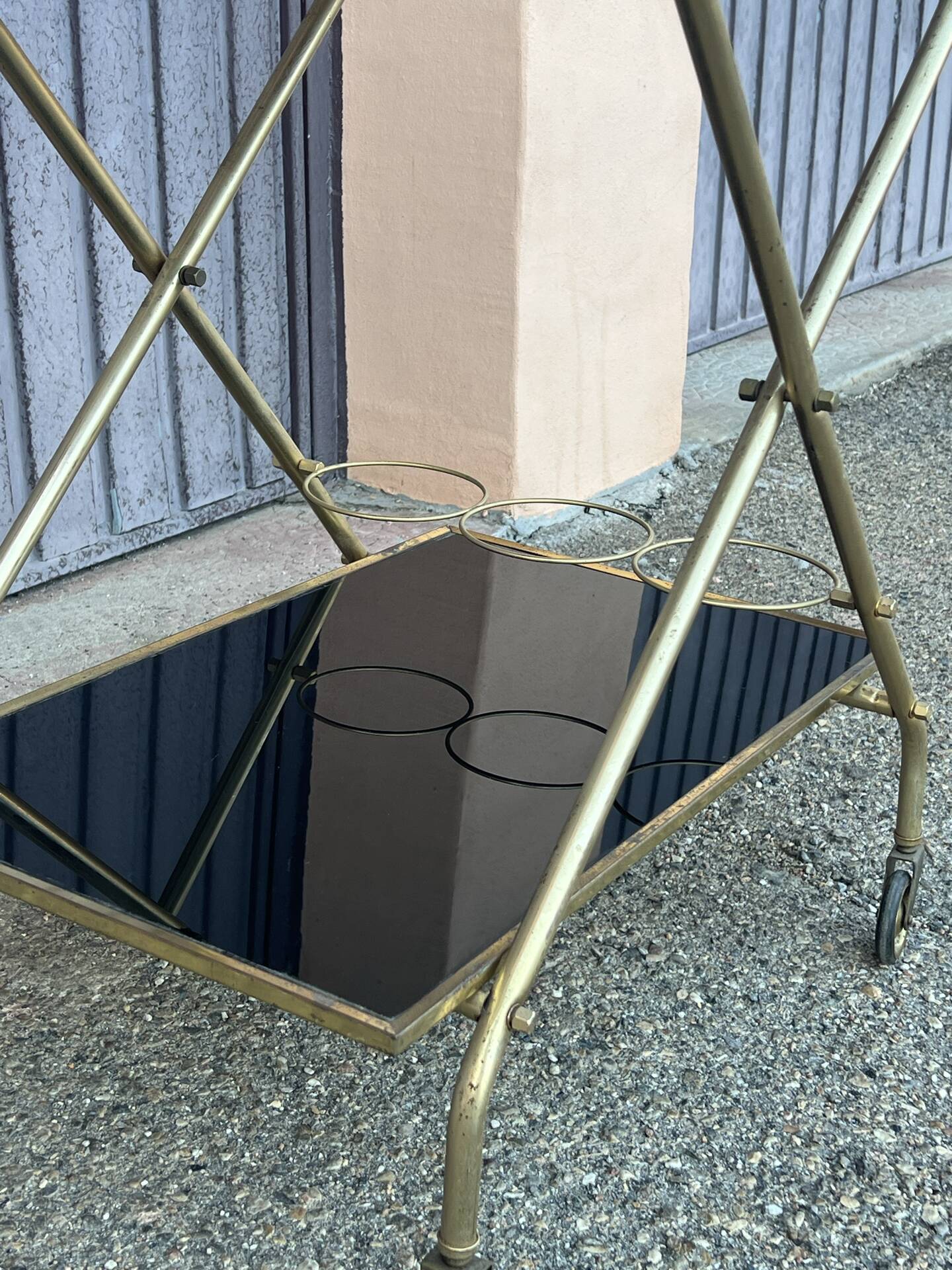 Vintage gold dessert bar with two black trays.