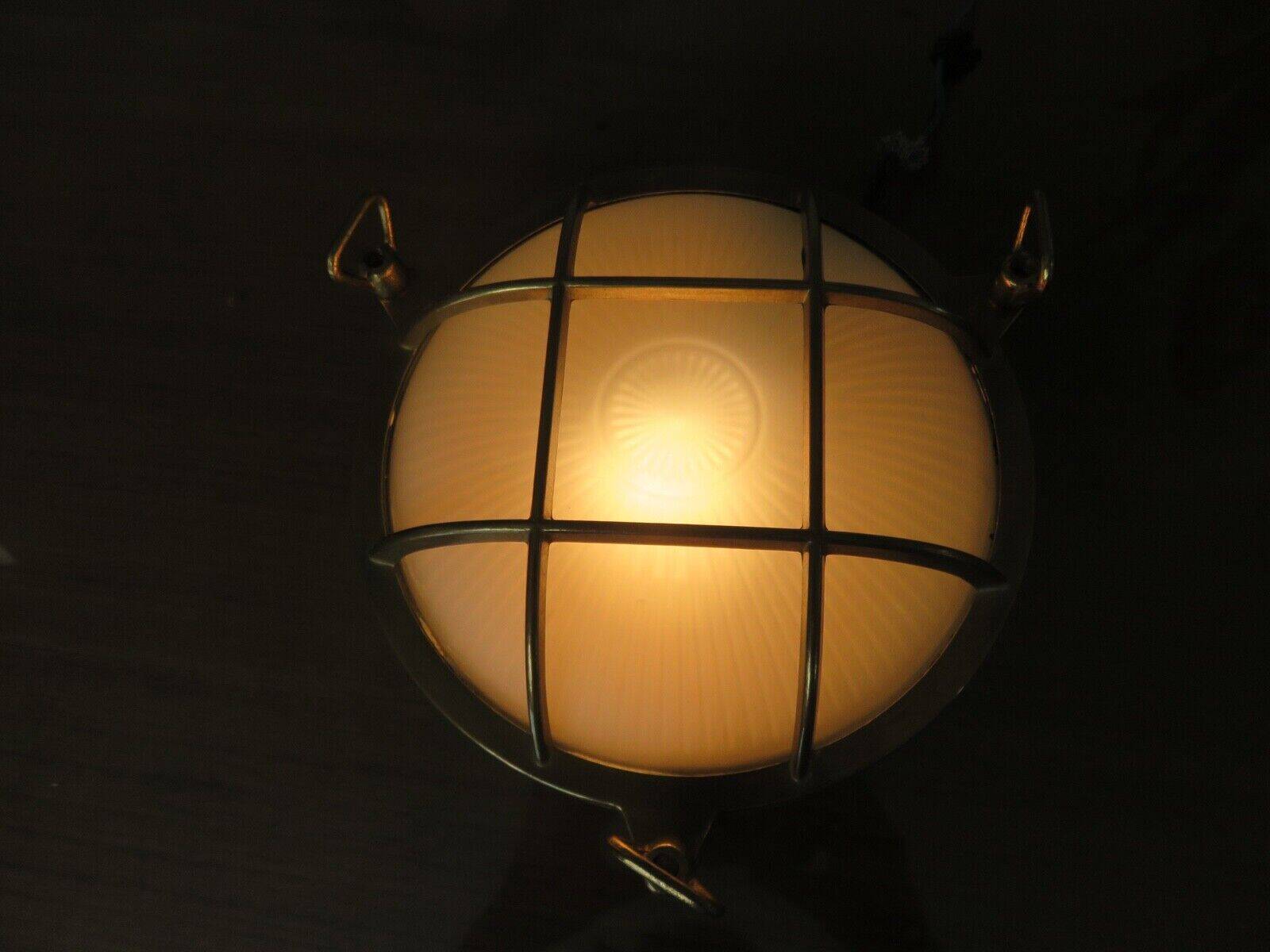 Brass porthole wall lamp