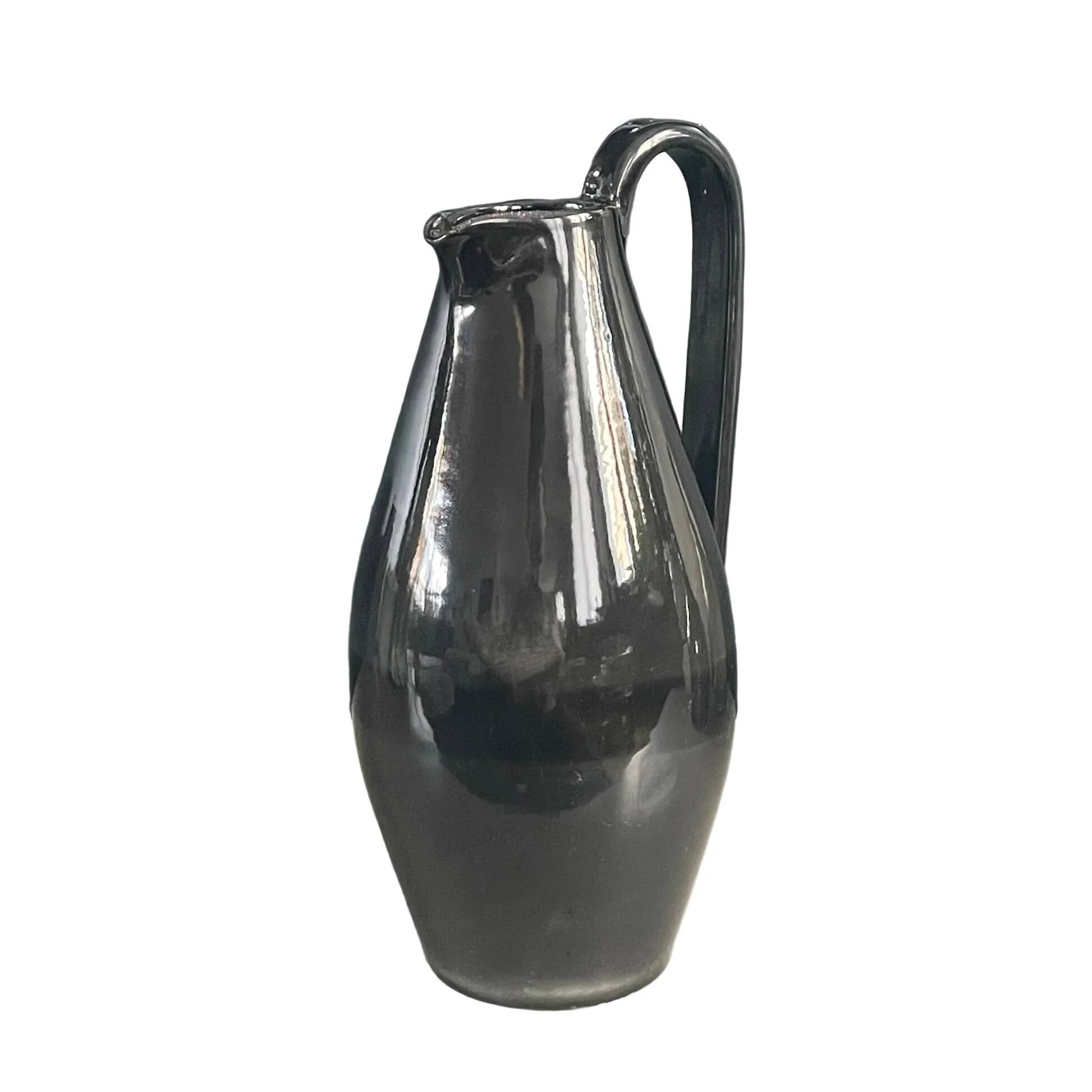 Black glazed ceramic pitcher signed M Azouit