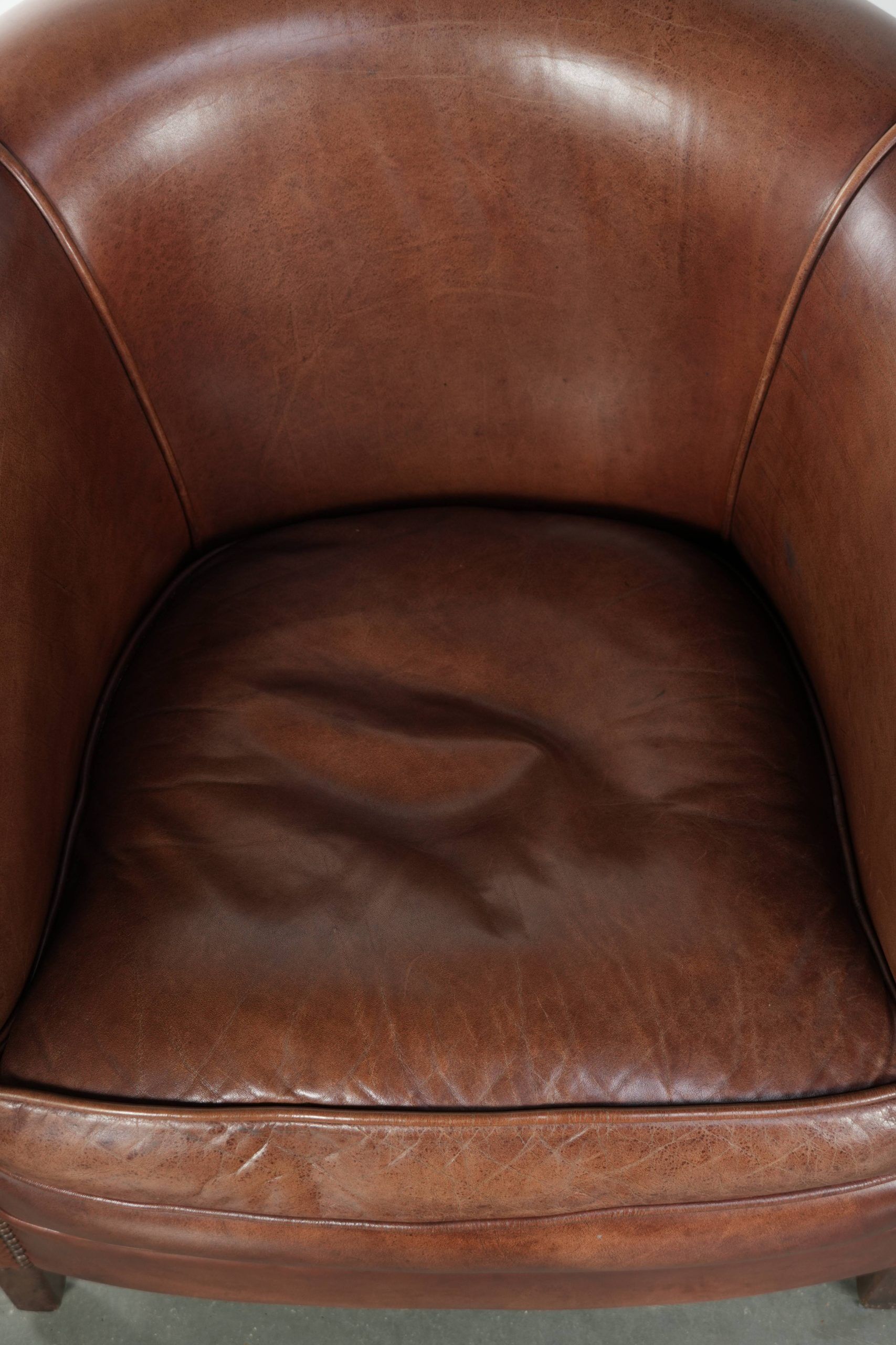 Cow leather club armchair in beautiful dark cognac colour in English style