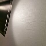 Cone pendant produced by Danish Lyfa in beautiful black lacquer with perforated shade and brass top.