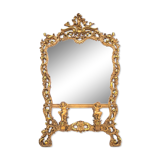 A large mirror in a gold frame, Italy, first half of the 20th century.