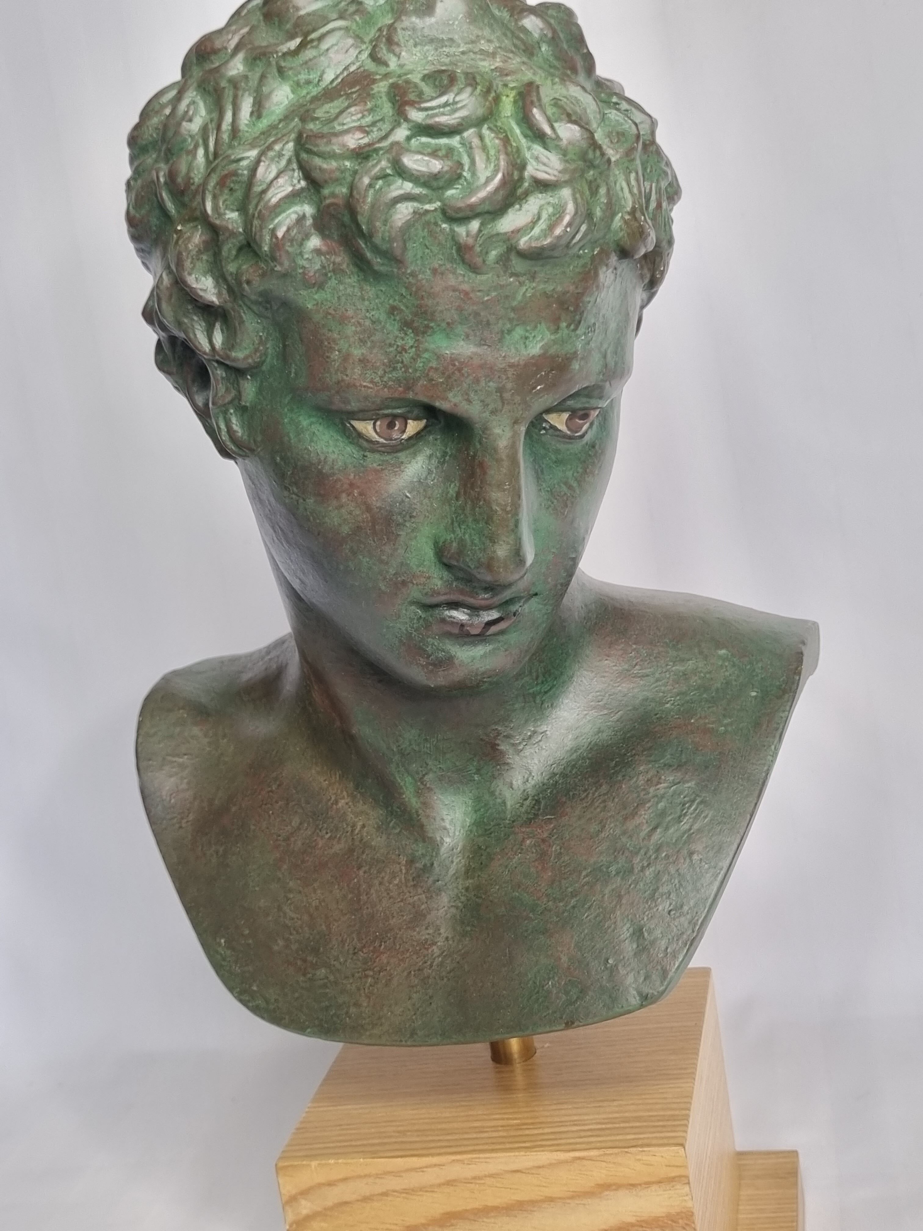 Bust of the Ephebus of Marathon in patinated plaster on base