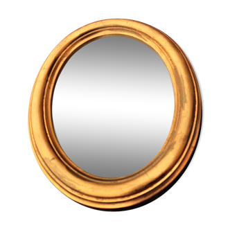 Oval mirror of 30 x 24 cm with its golden entourage of biedermeier