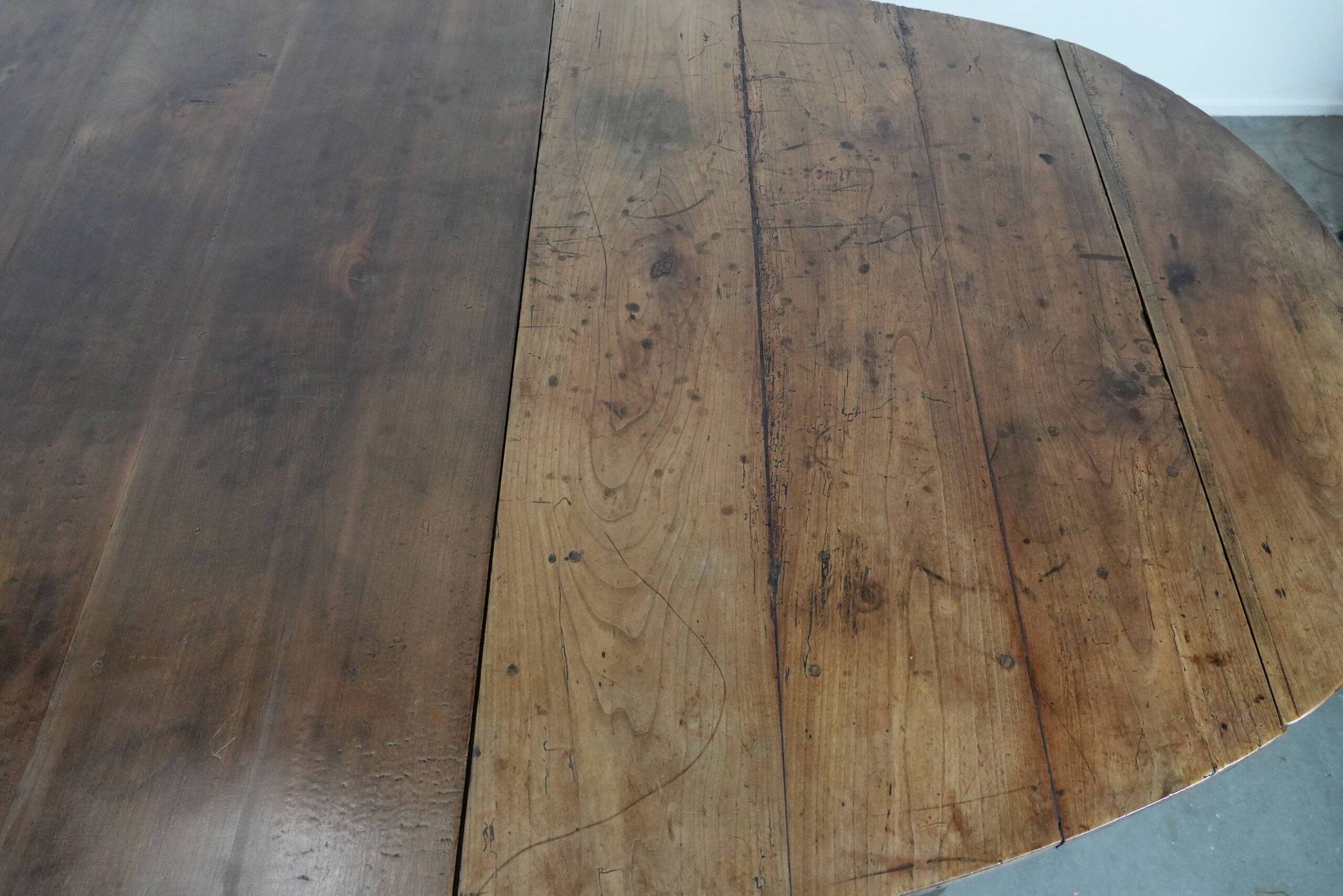 Rare antique oval French extendable dining table made of fruitwood