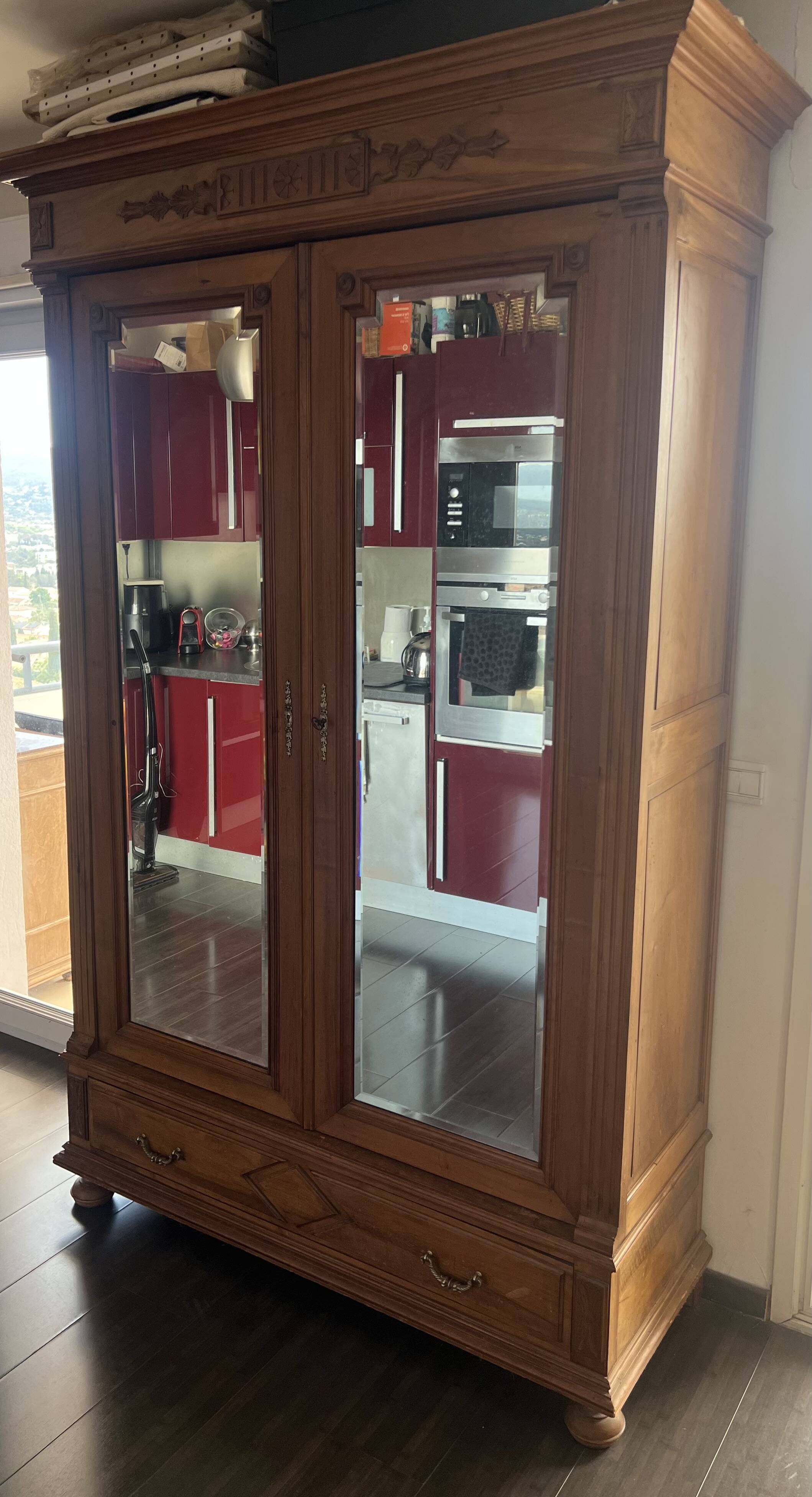 Walnut wardrobe with mirror doors.