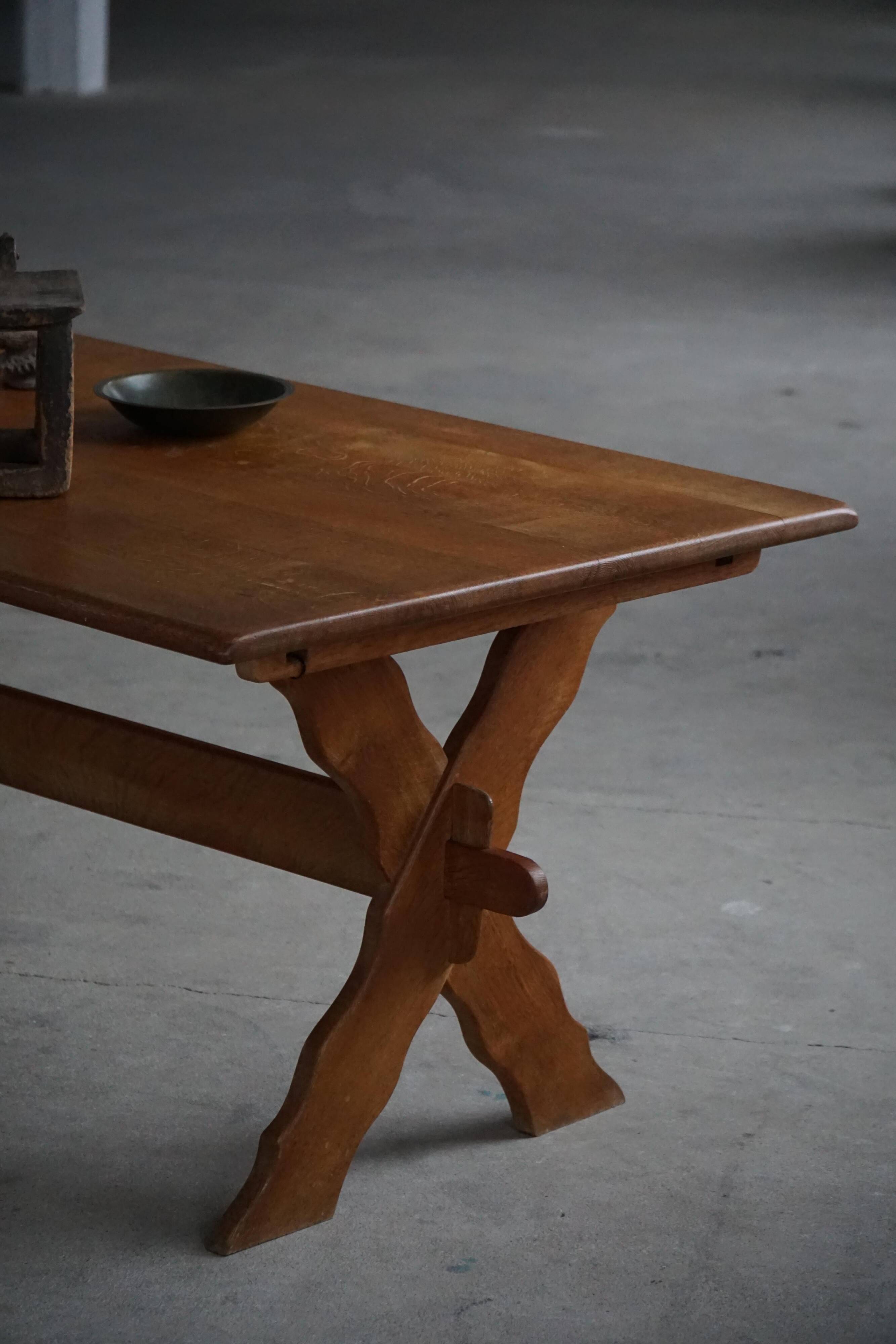 Solid oak dining table with cross base by Danish cabinetmaker, mid-20th century.