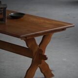 Solid oak dining table with cross base by Danish cabinetmaker, mid-20th century.