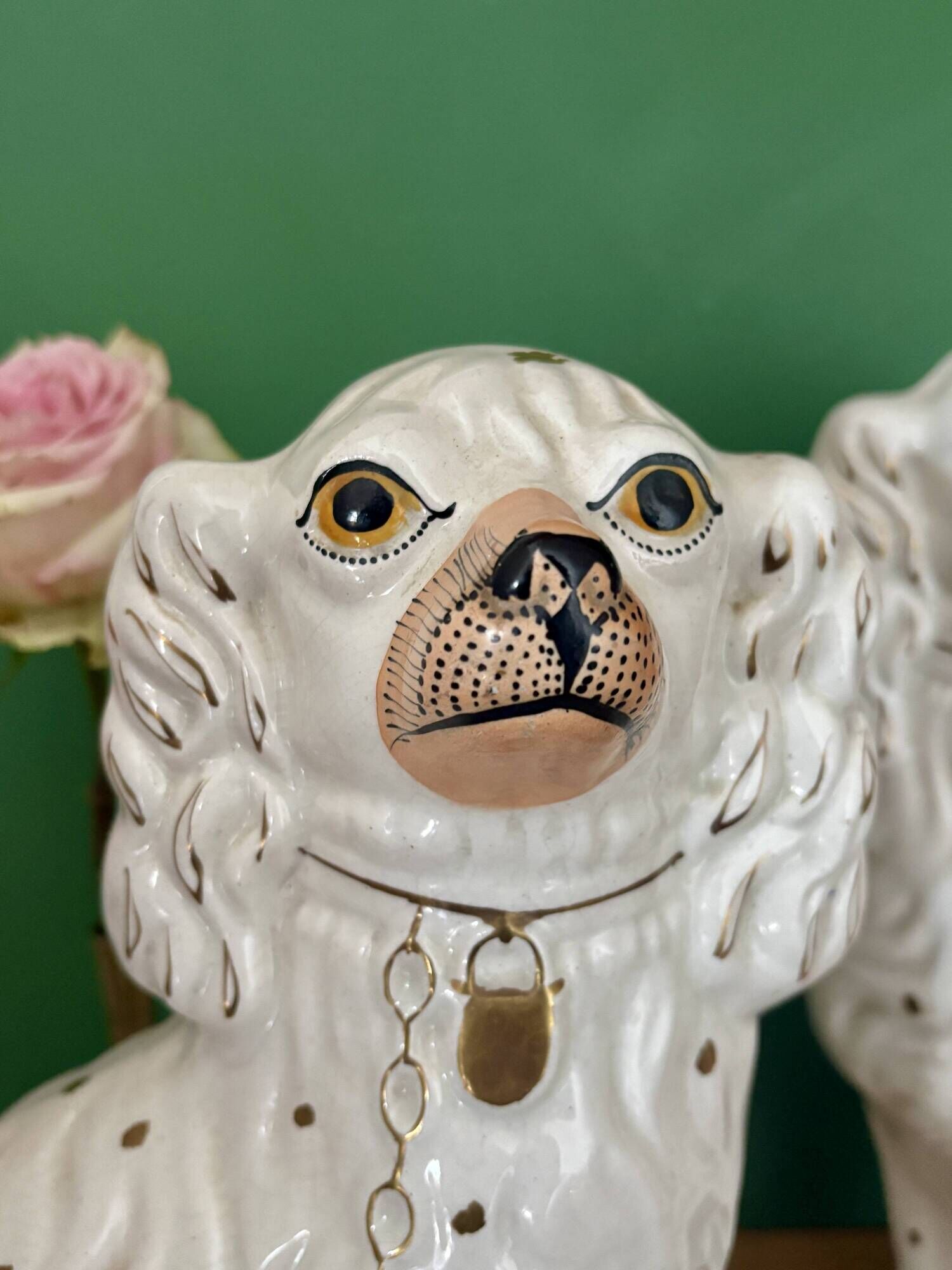 Pair of Staffordshire-type dogs in white and gold ceramic