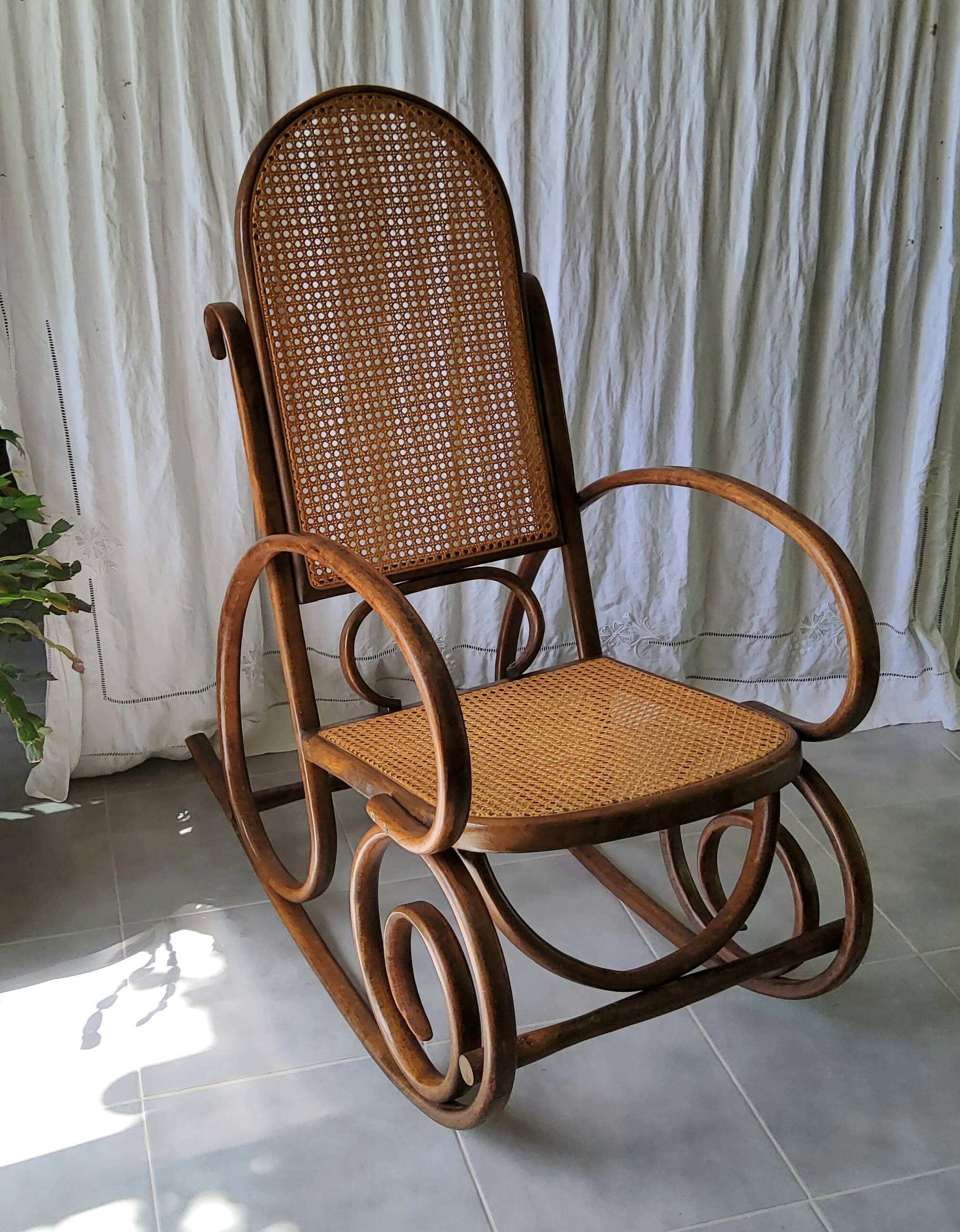 Antique caned rocking chair