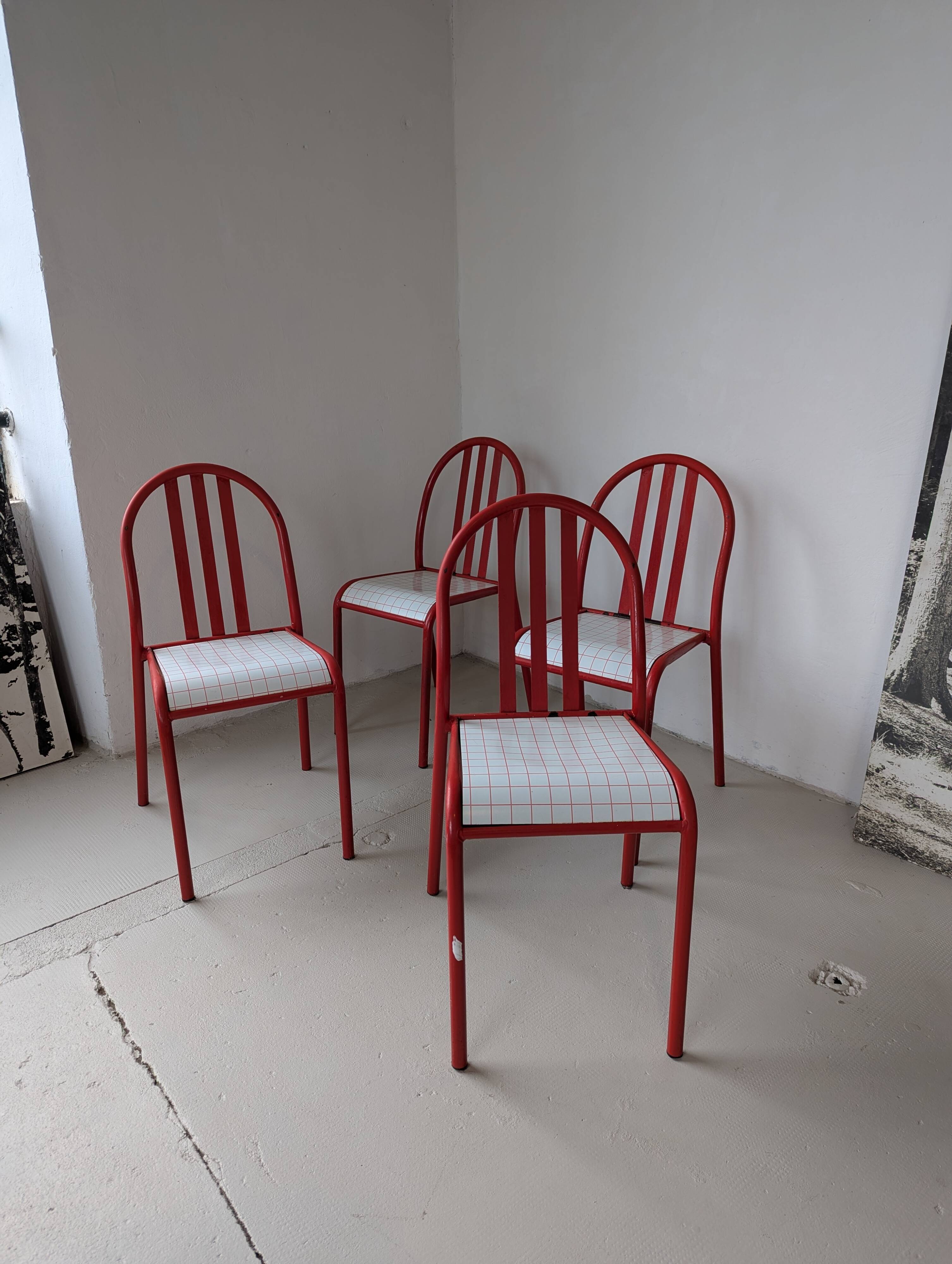 Set of 4 modernist red metal chairs
