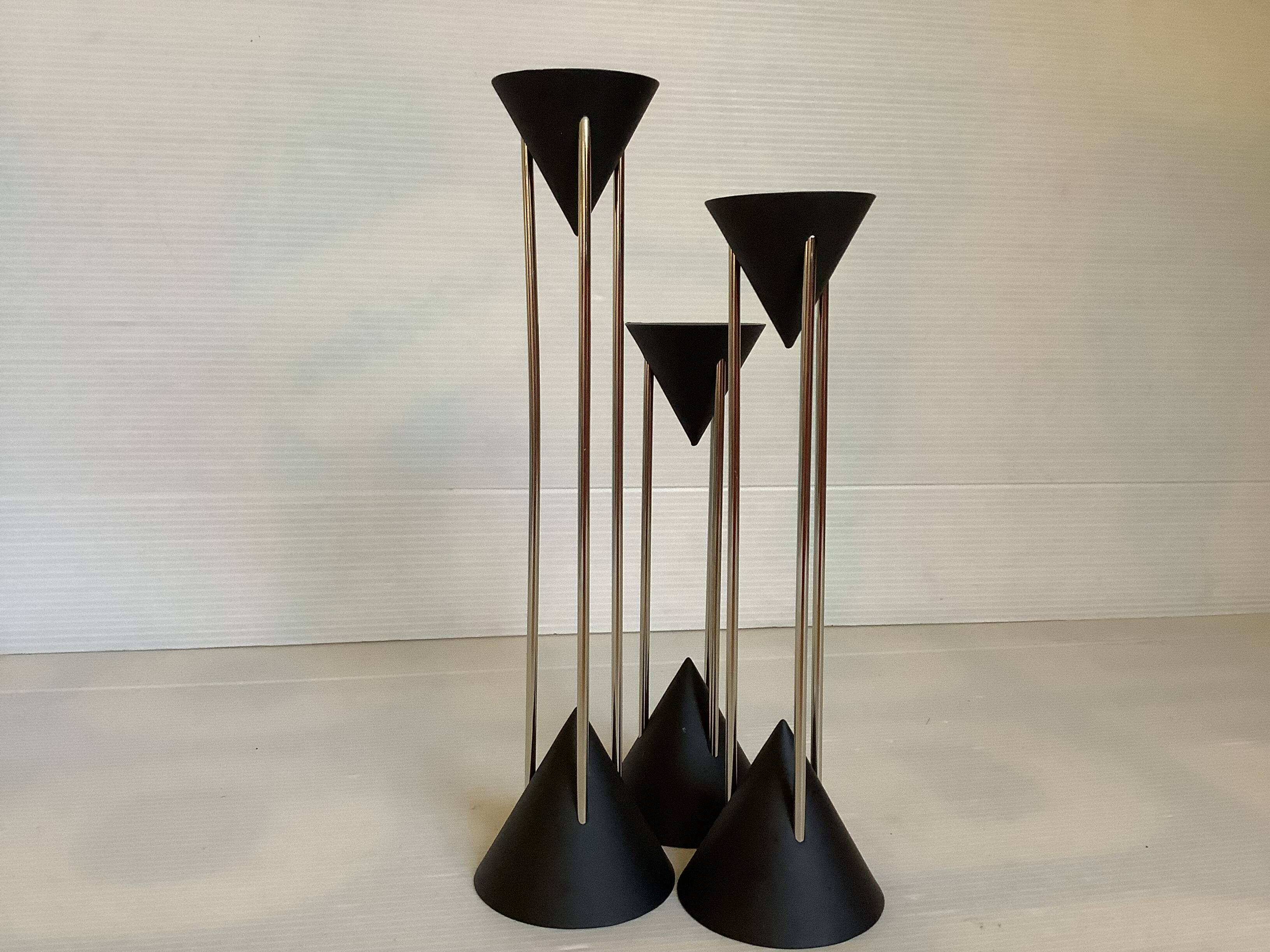 Vintage black candlestick trio