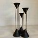 Vintage black candlestick trio