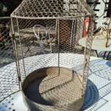 iron bird cage with a crown