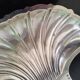 Butter dish, small bowl or shell-shaped trinket dish in silver-plated metal.