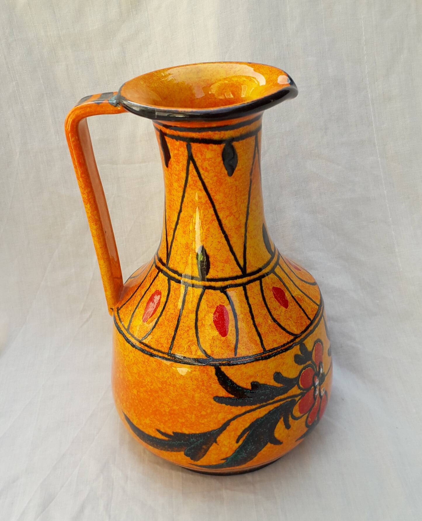 Orange ceramic jug