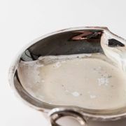 Vintage 1960s silver-plated catchall, double heart shell with ring handle.
