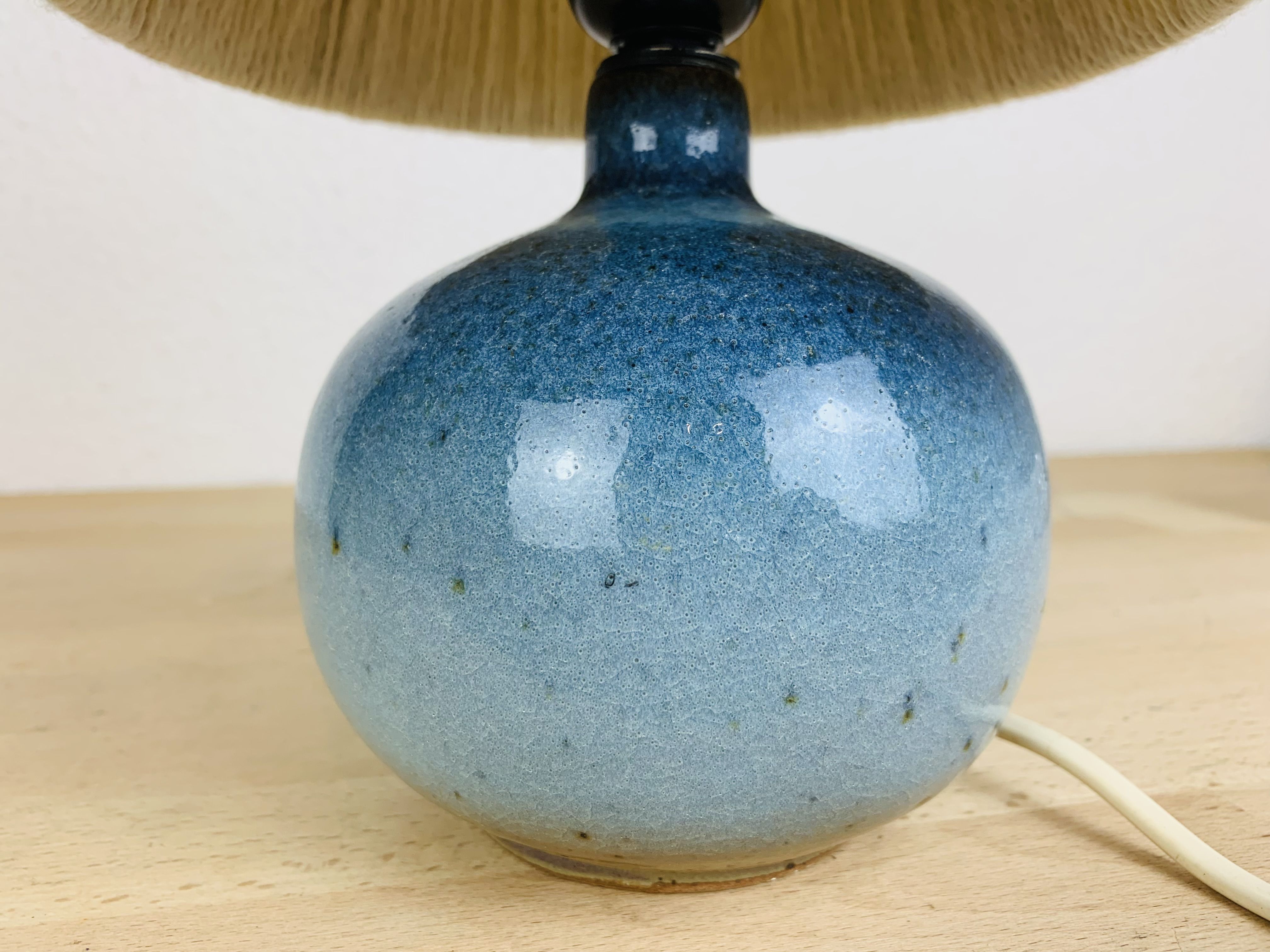 Blue ceramic ball lamp by Willy Dougoud