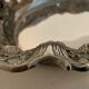 Empty open silver metal pocket