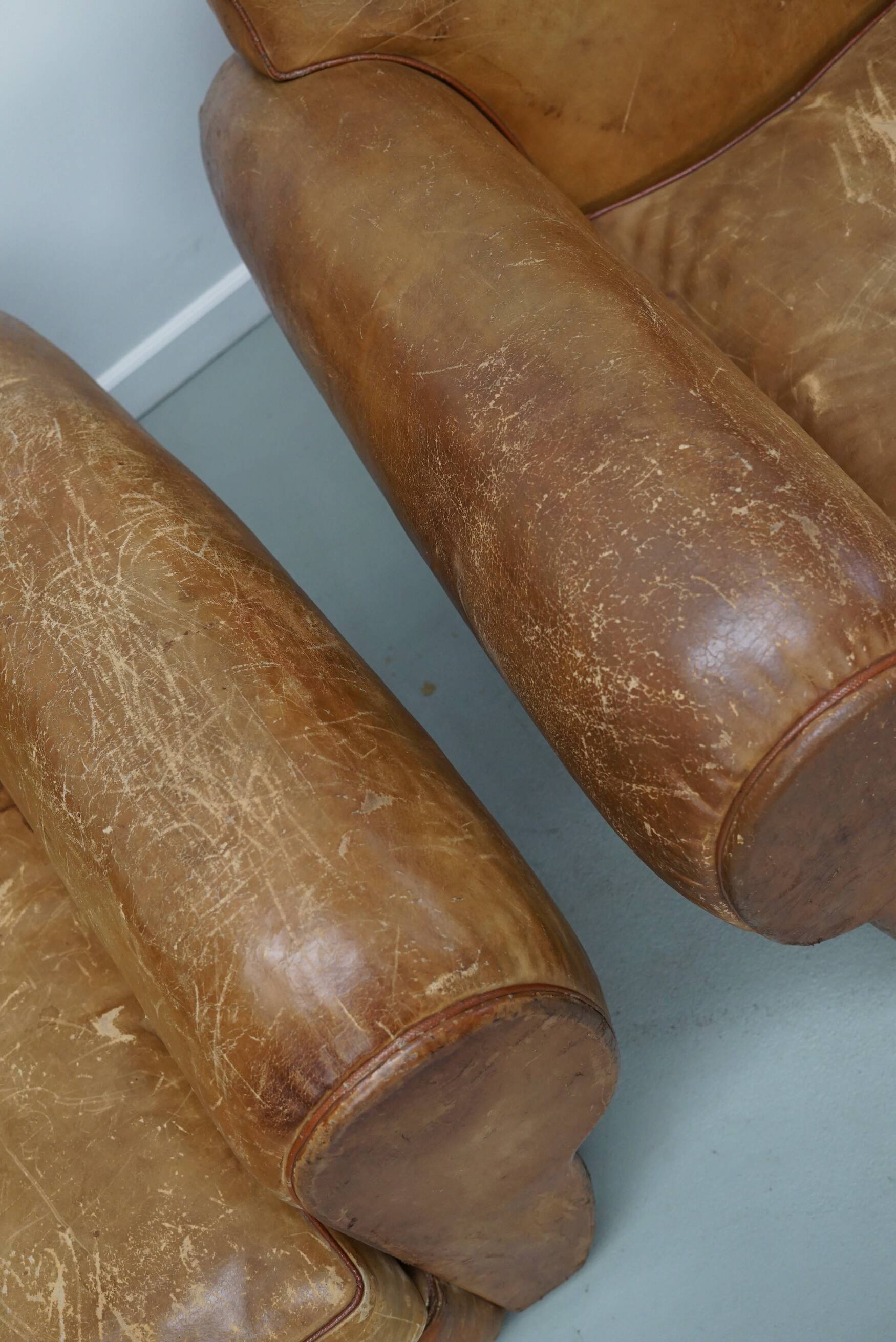 Pair of French club chairs with moustache back in cognac leather, 1940s