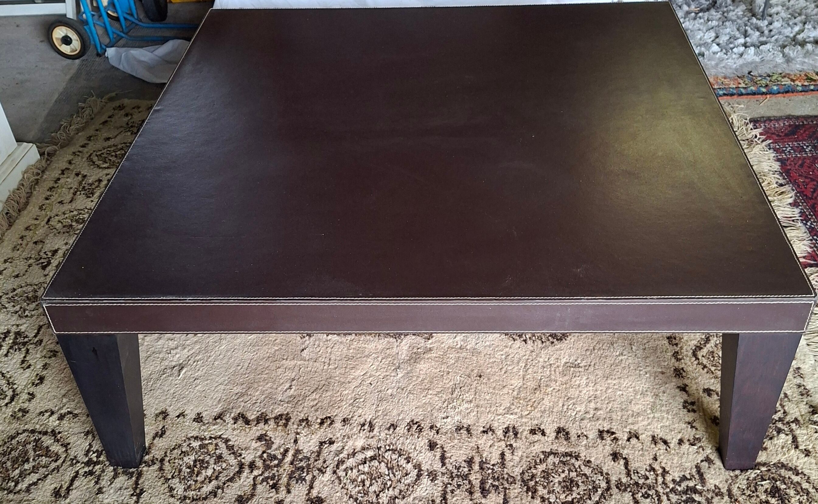 Leather-covered coffee table Roche Bobois