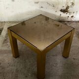 Trio of nesting tables, brass structures and smoked mirror tops
