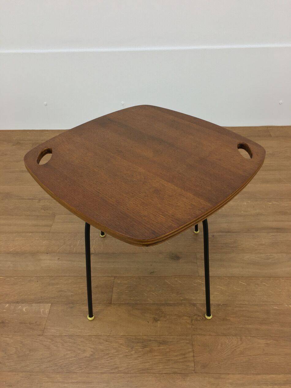 Modernist side table, 1950s, wood and metal, with handles.
