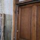 Old solid oak front door with frame and transom from the 19th century.
