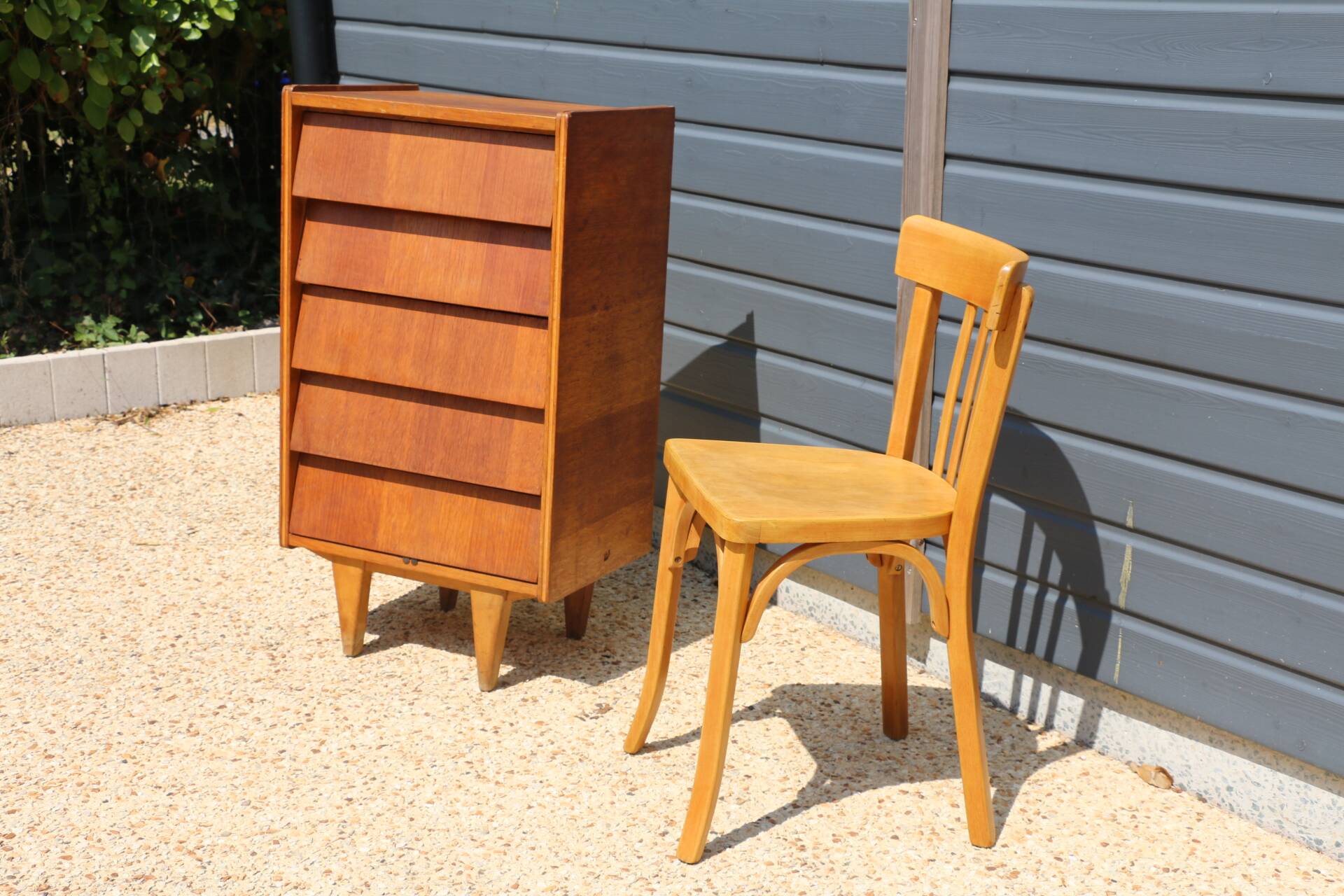 Dark chest of drawers with 5 drawers from the 1950s