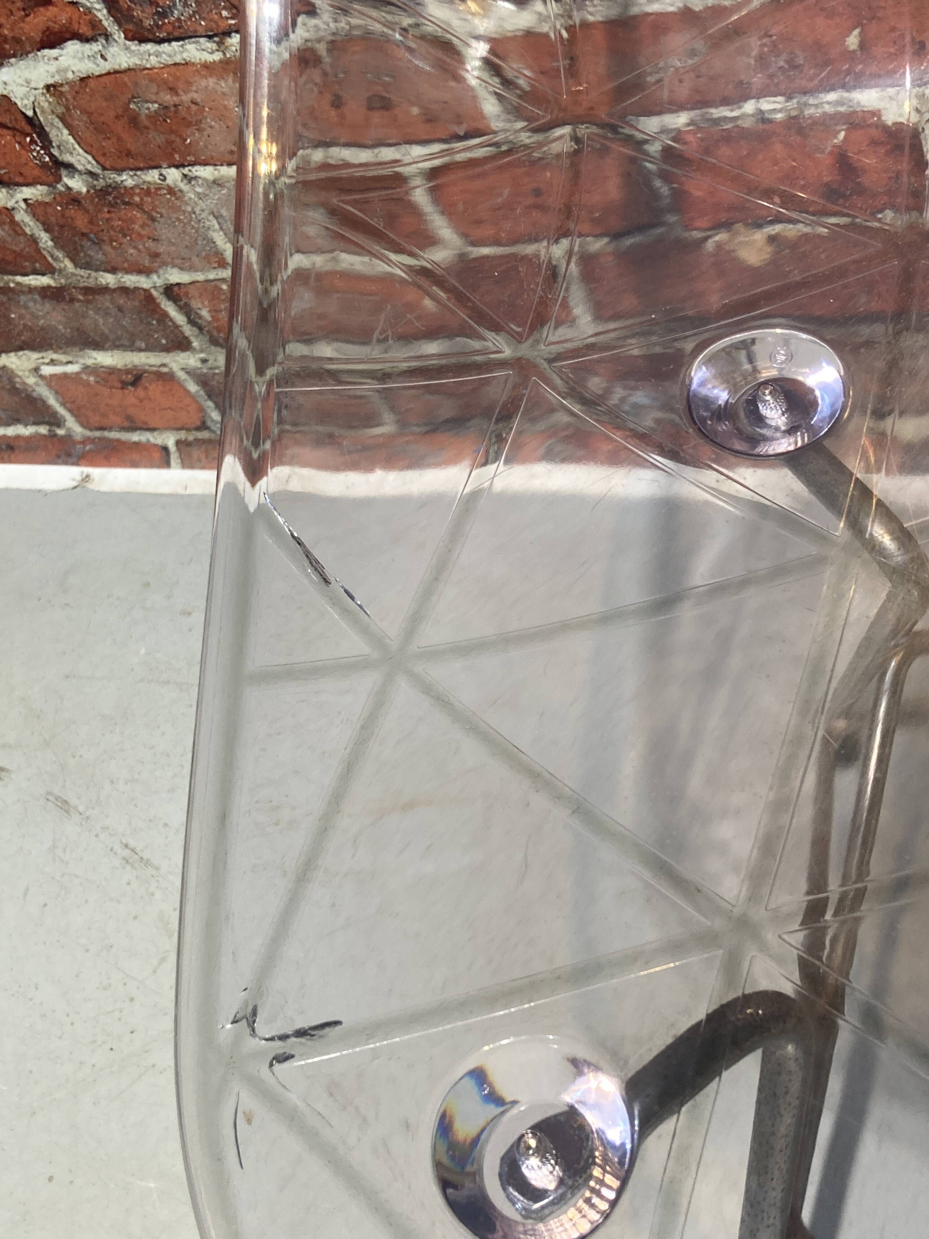 Set of four plexiglass and metal chairs