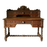 Counter desk and tiered seating in Neo-Renaissance oak