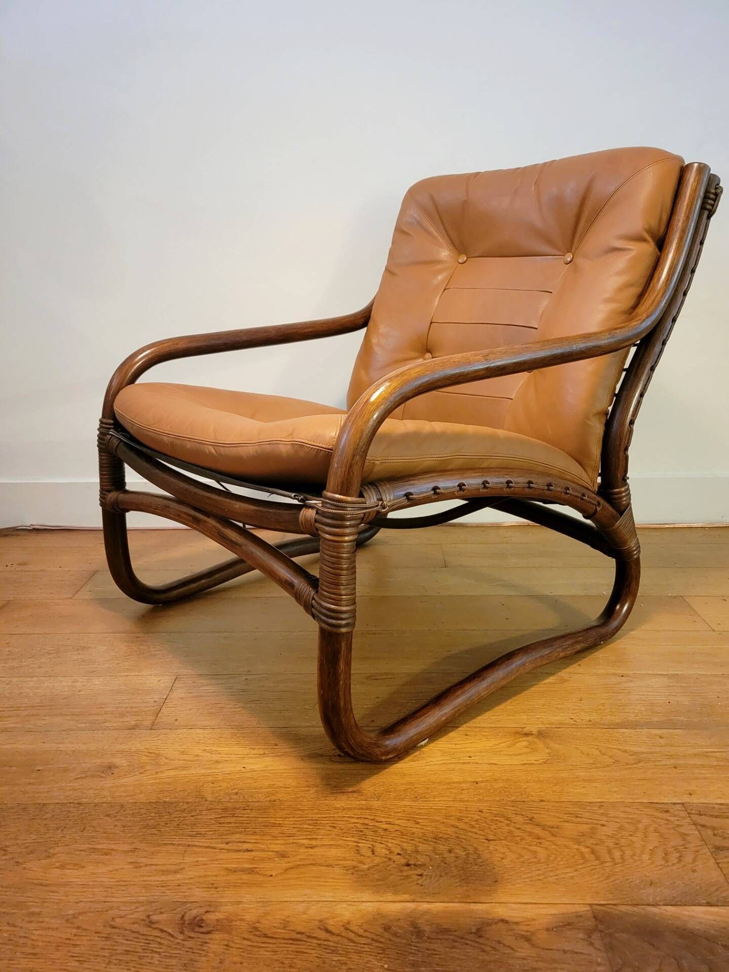 Vintage rattan armchair with leather cushions from 1970